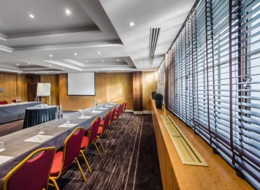 Large meeting room looking towards the projector screen.